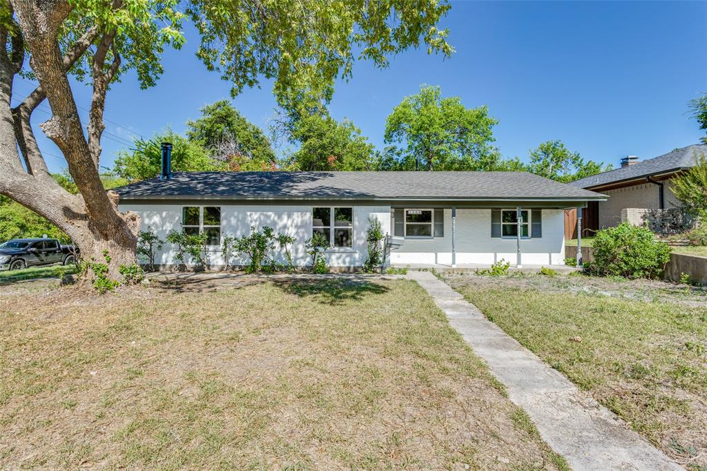 a view of house with yard and entertaining space