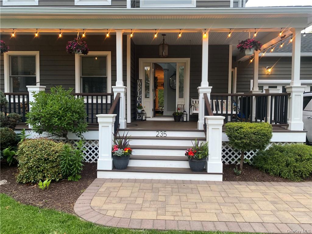 a front view of a building with potted plants