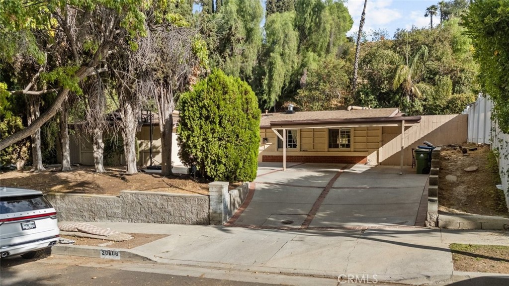 front view of a house with a tree