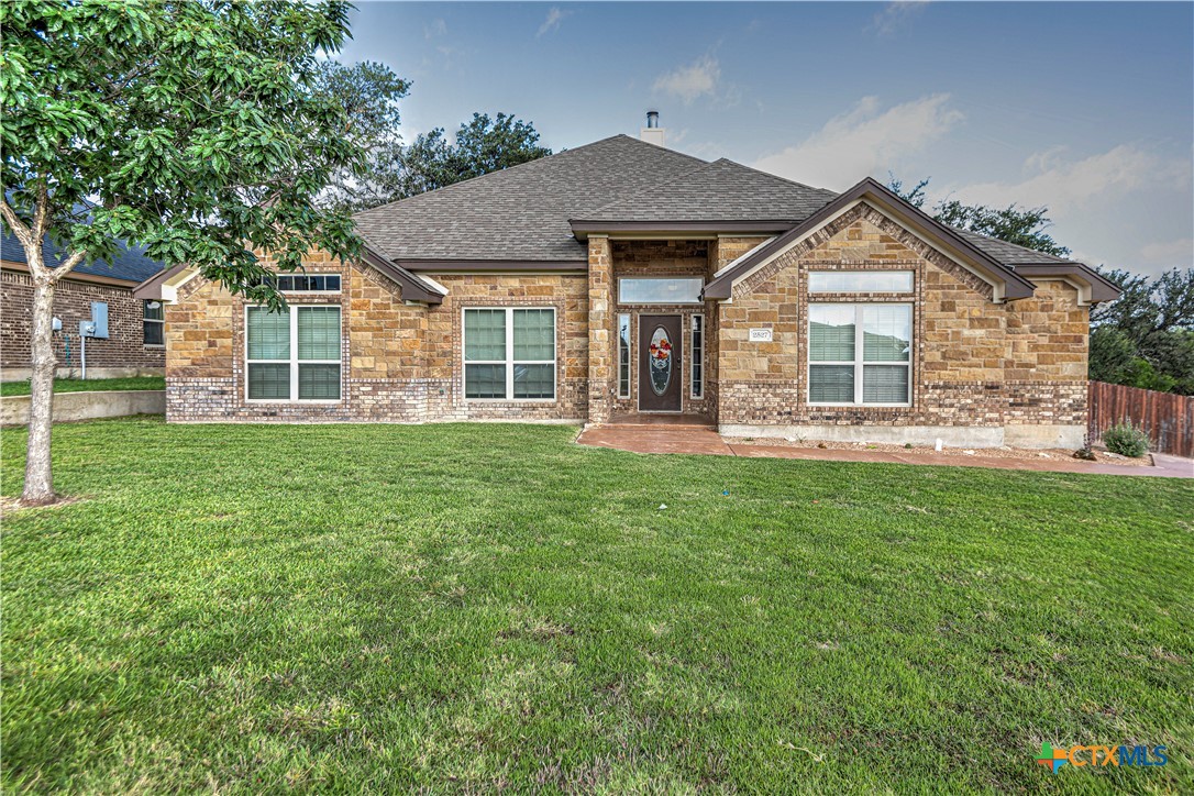 front view of a house with a yard