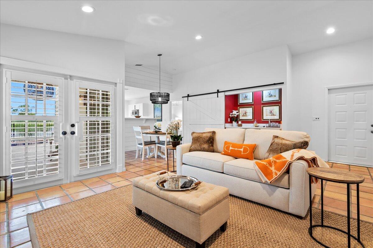 a living room with furniture and a table