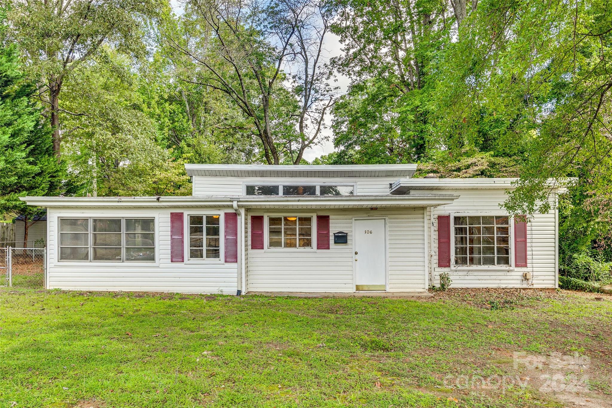 front view of a house with a yard