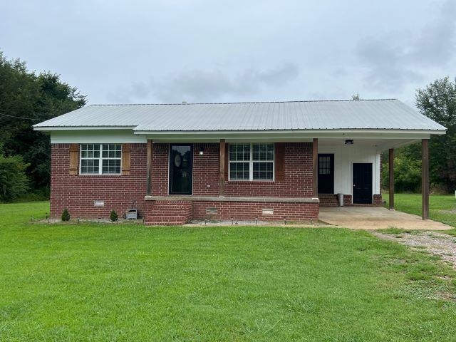 front view of a house with a yard