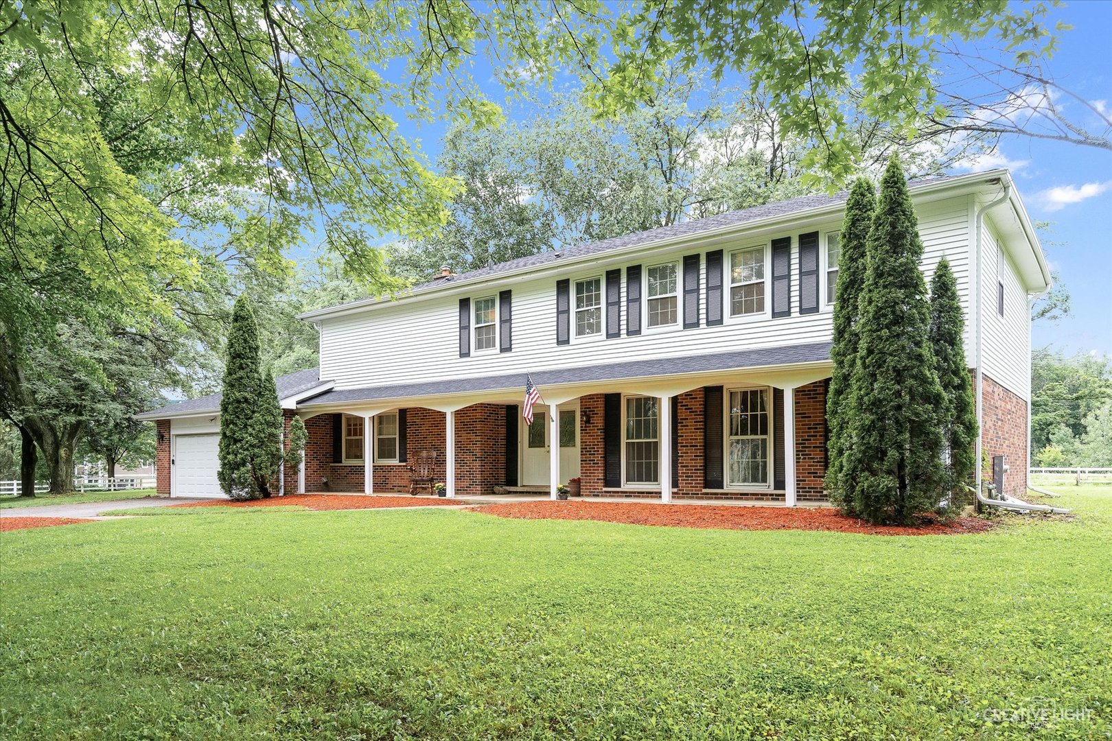 front view of a house with a yard