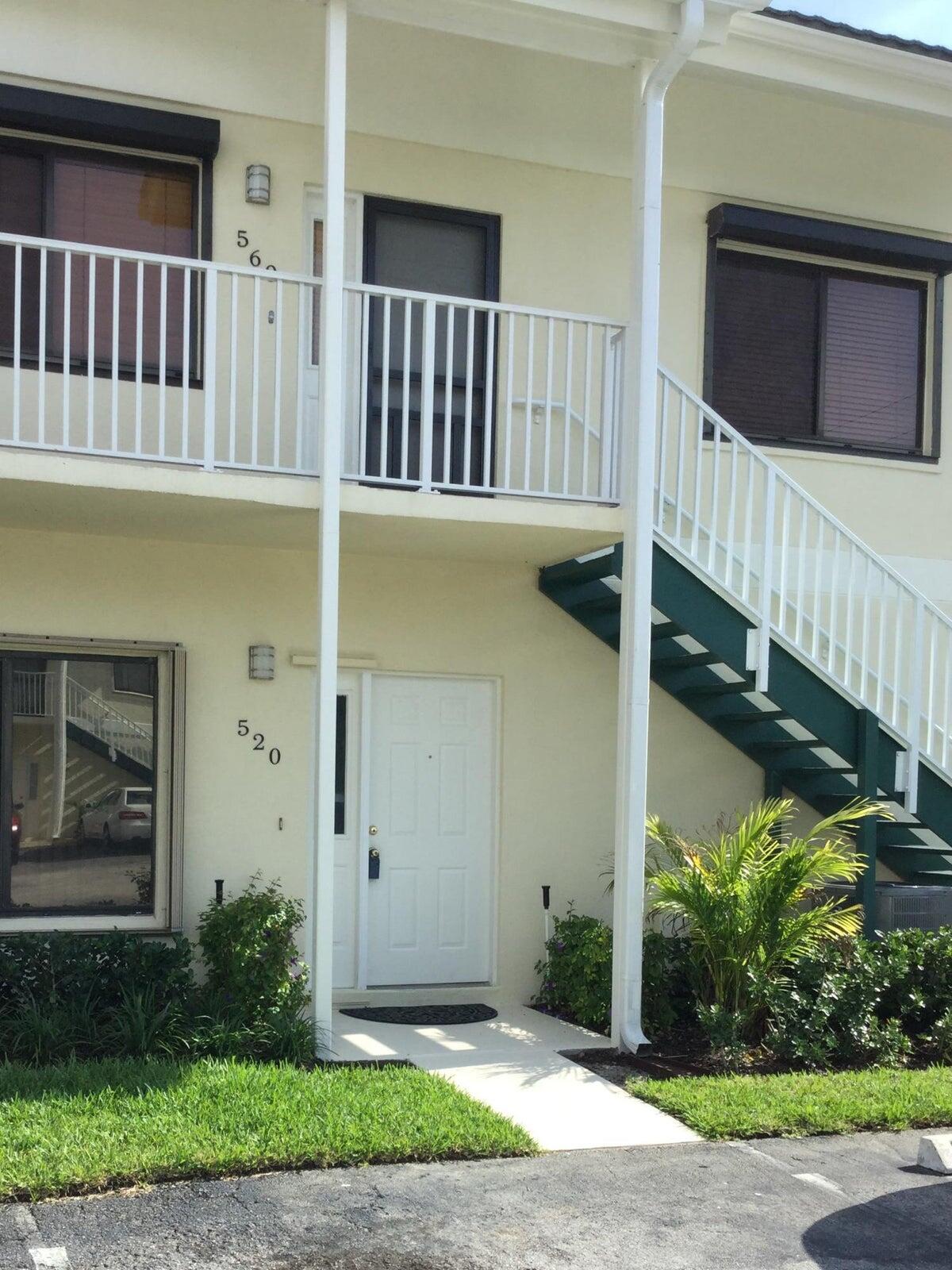 a view of a house with a small yard