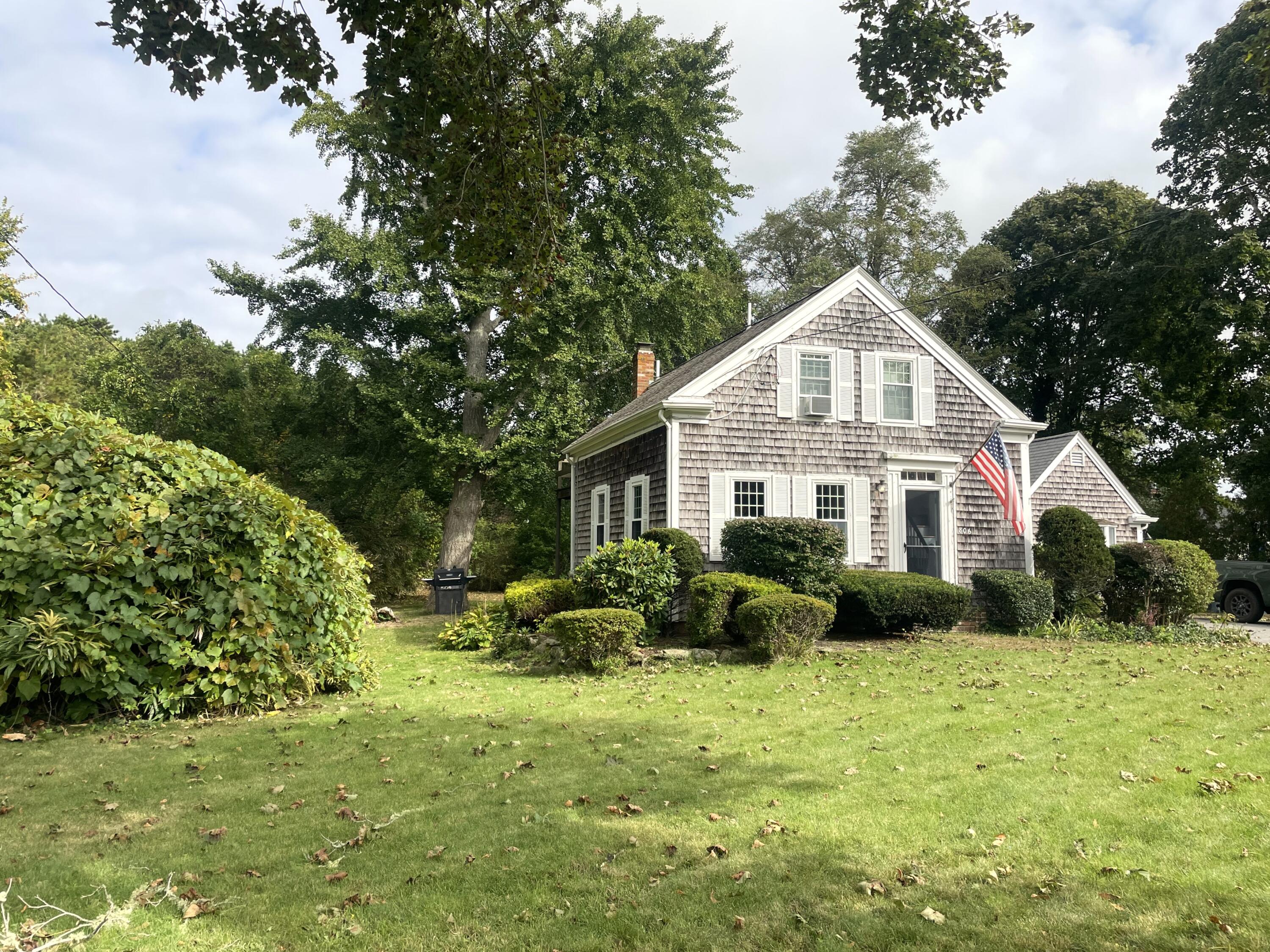 a front view of house with yard and green space