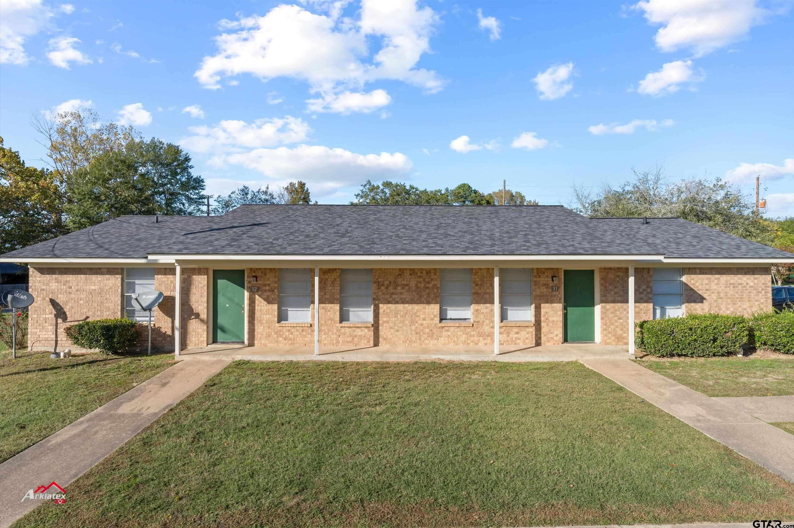 front view of a house with a yard