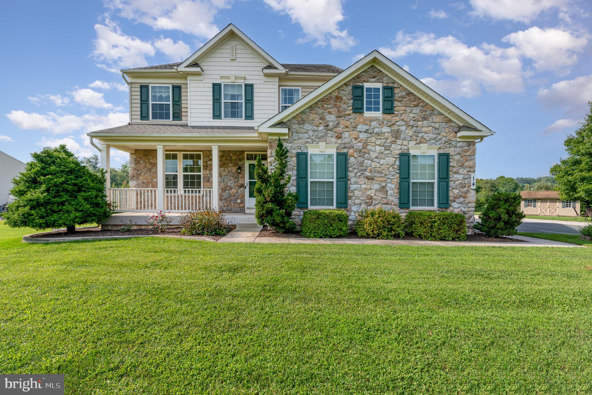 a front of a house with a garden