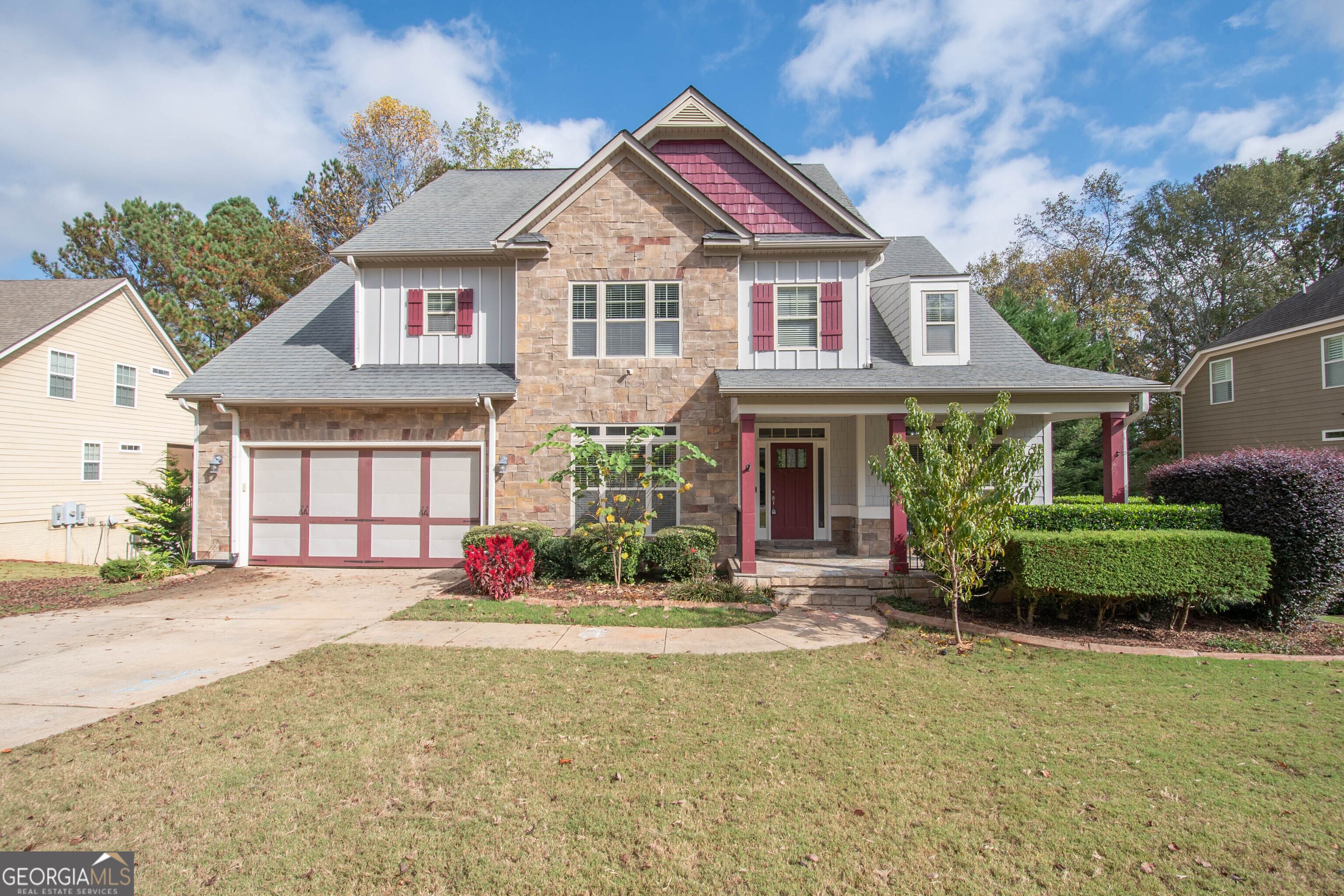 a front view of a house with a yard