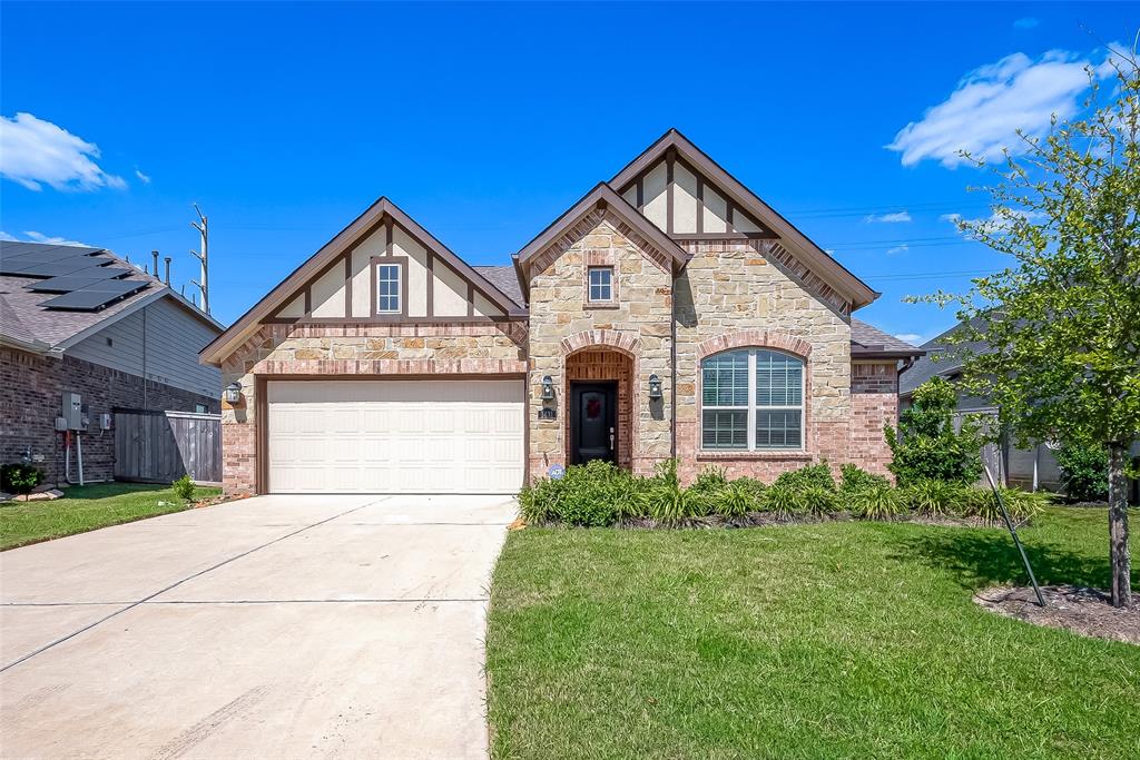 This modern-style home features a clean and contemporary exterior with a welcoming front porch.