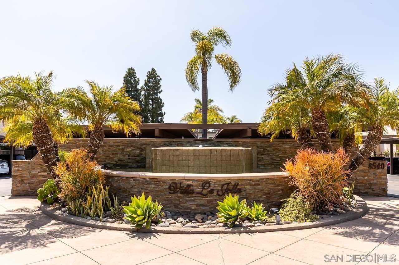 a view of a water fountain in front of a house