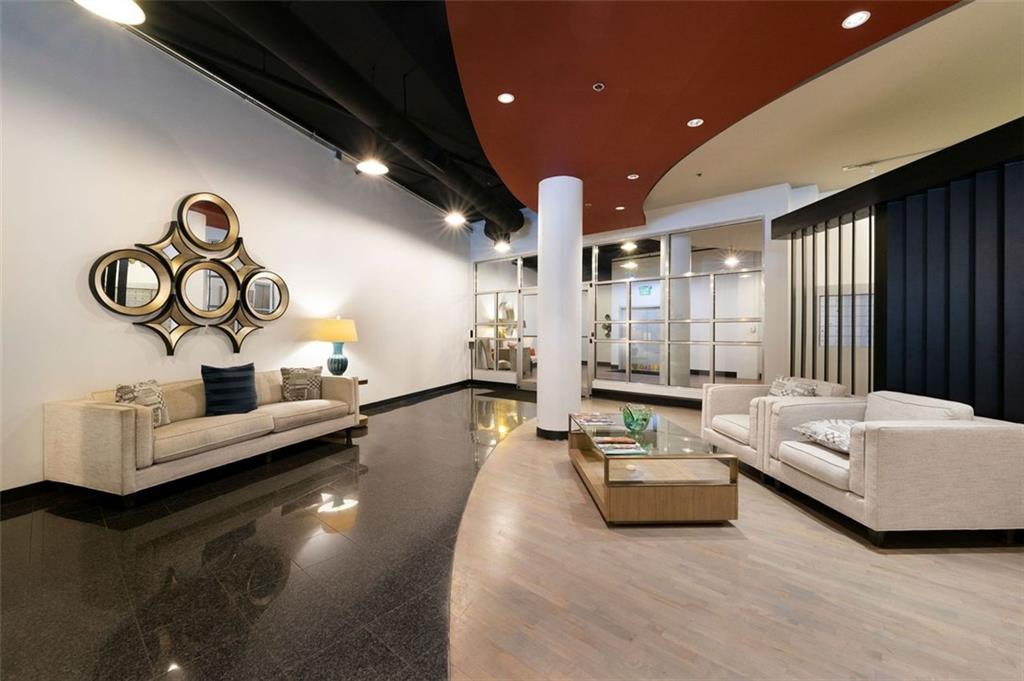 a living room with furniture and white walls