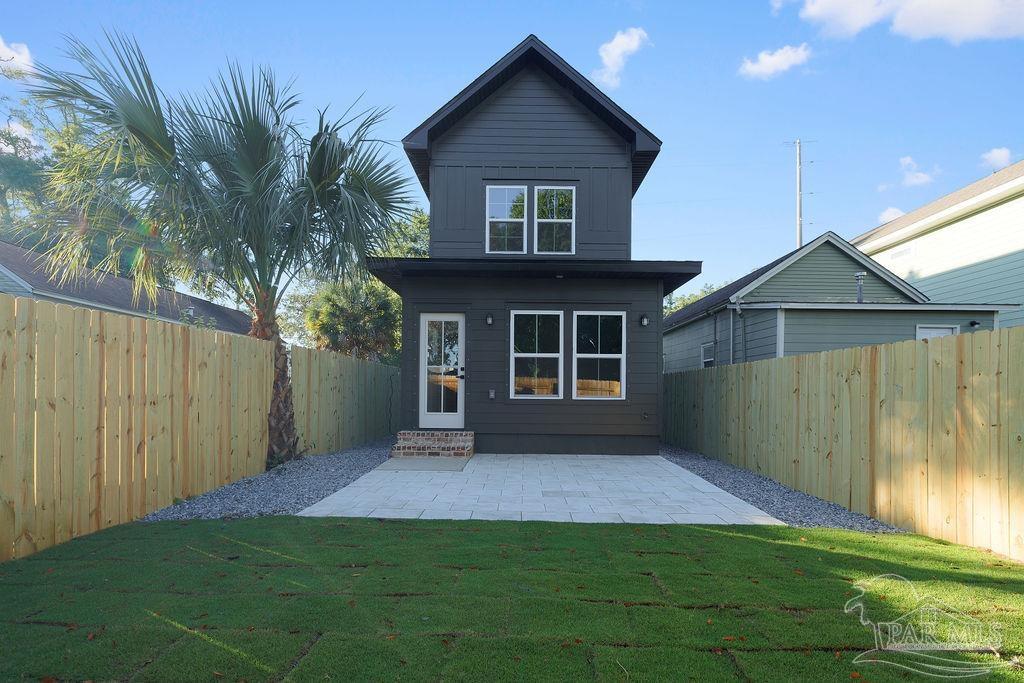 a view of backyard with a garden and deck