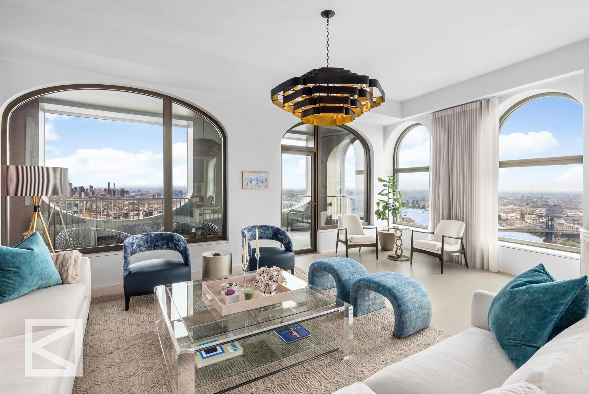 a living room with furniture chandelier and a large window