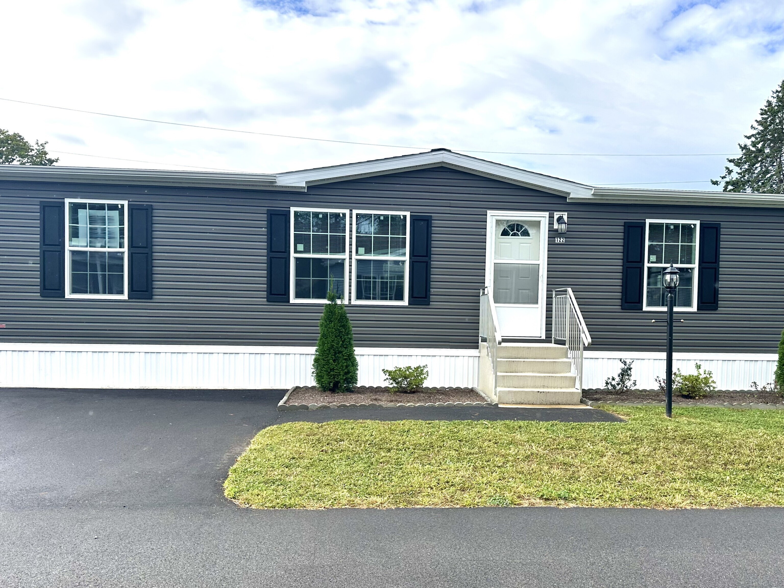 front view of a house with a yard