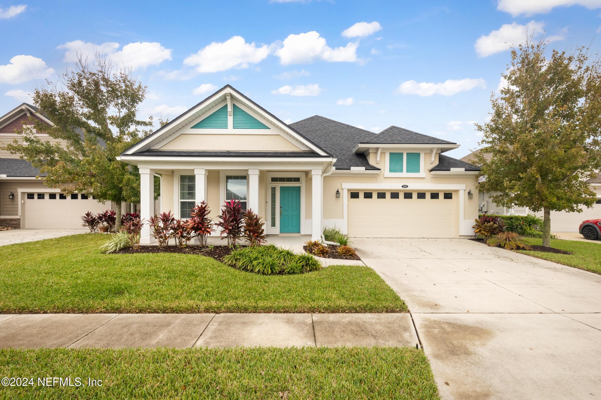 a view of a house with a yard