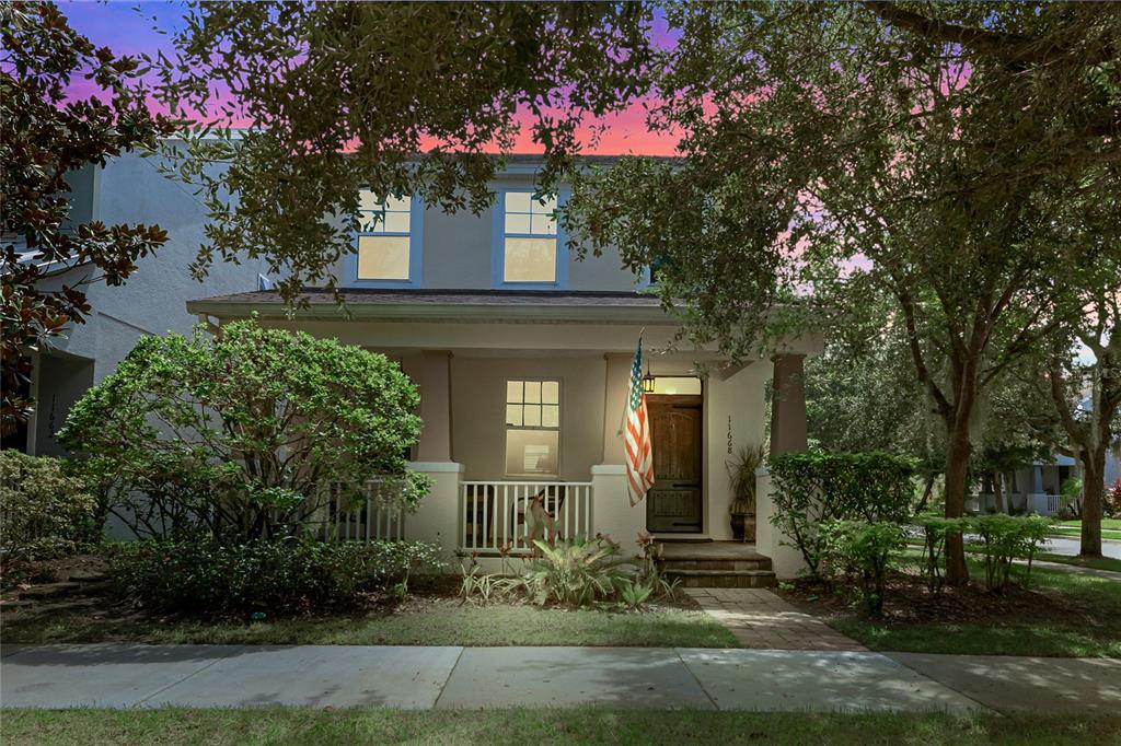 a front view of a house with garden