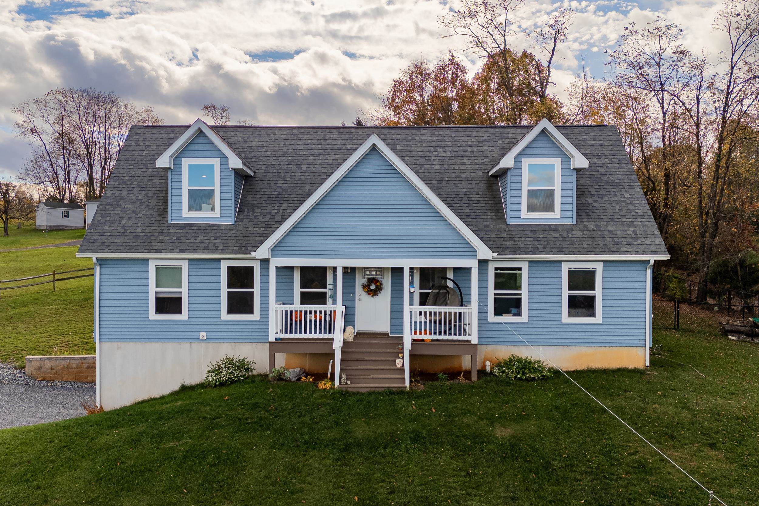 a front view of a house with a yard