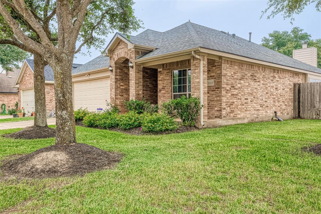 Welcome home to 20202 Coopers Gulch Trl located in Katy and zoned to Cy Fair ISD! This stunning home has lovely curb appeal, a well-manicured lawn, brick elevation, stained front door, traditional style, beautiful outdoor lanterns and a double wide driveway!