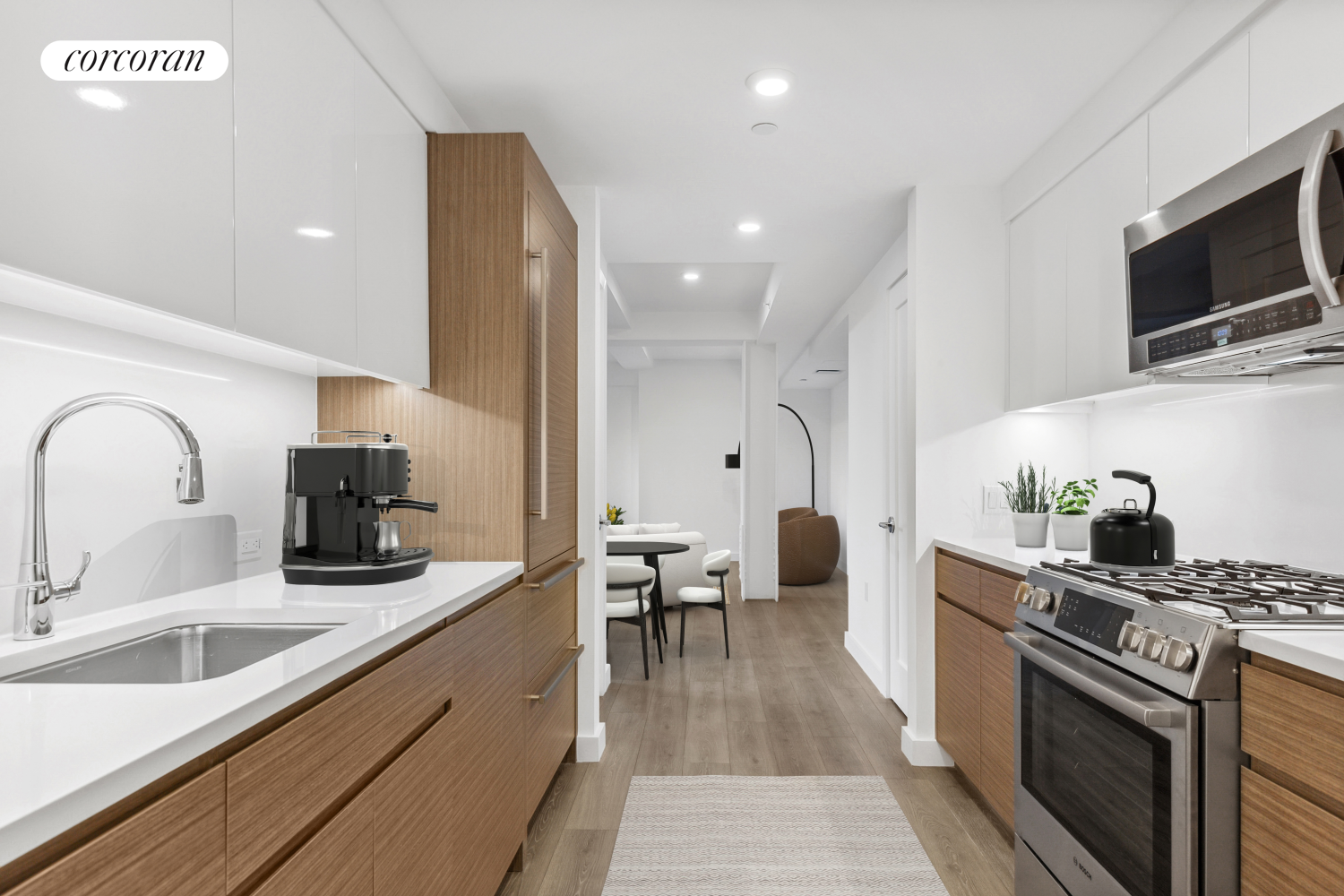 a kitchen with sink a stove and cabinets