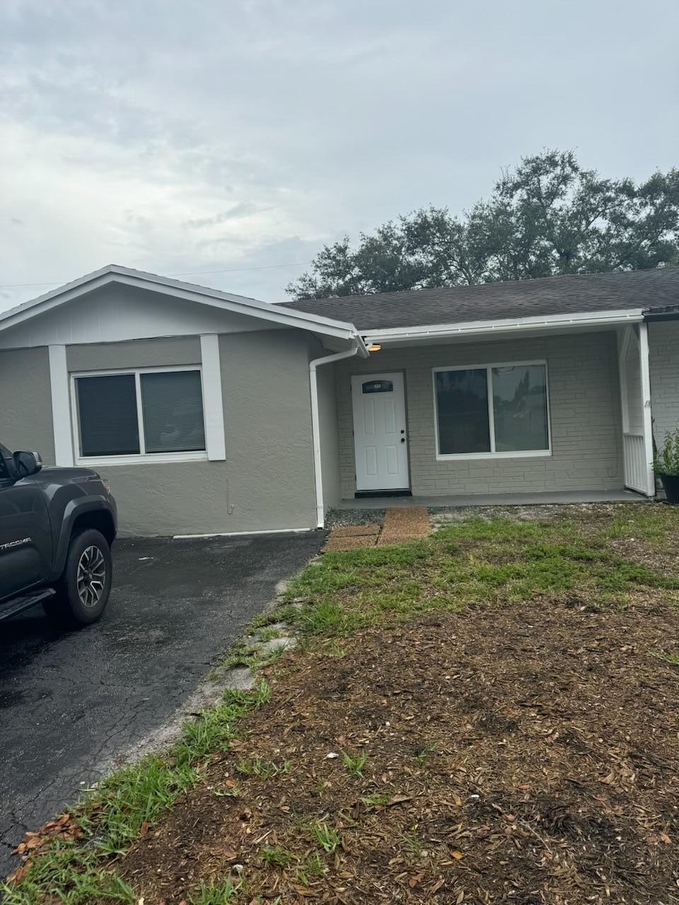 a view of a house with a yard