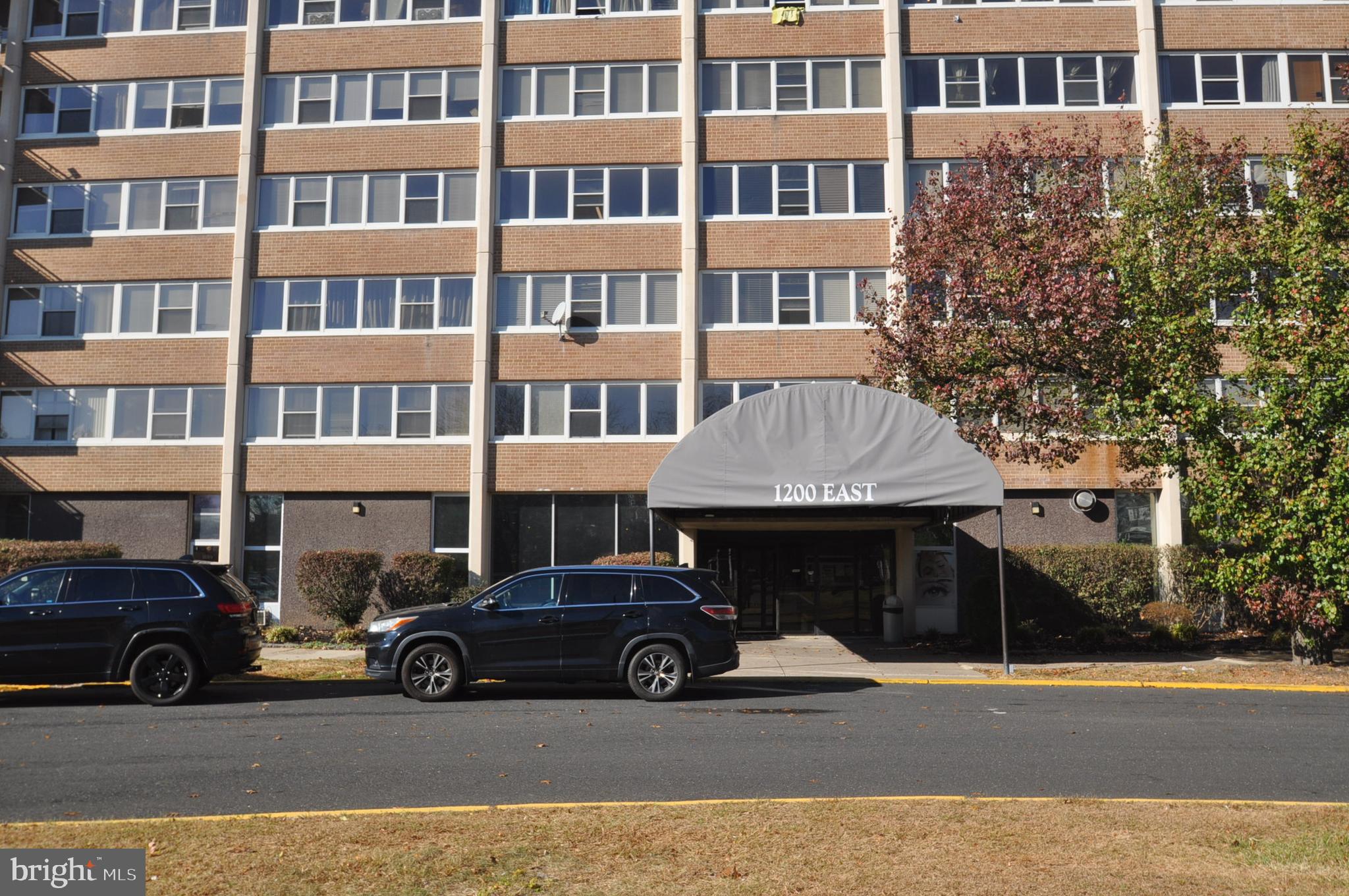 a view of a car parked in front of a building