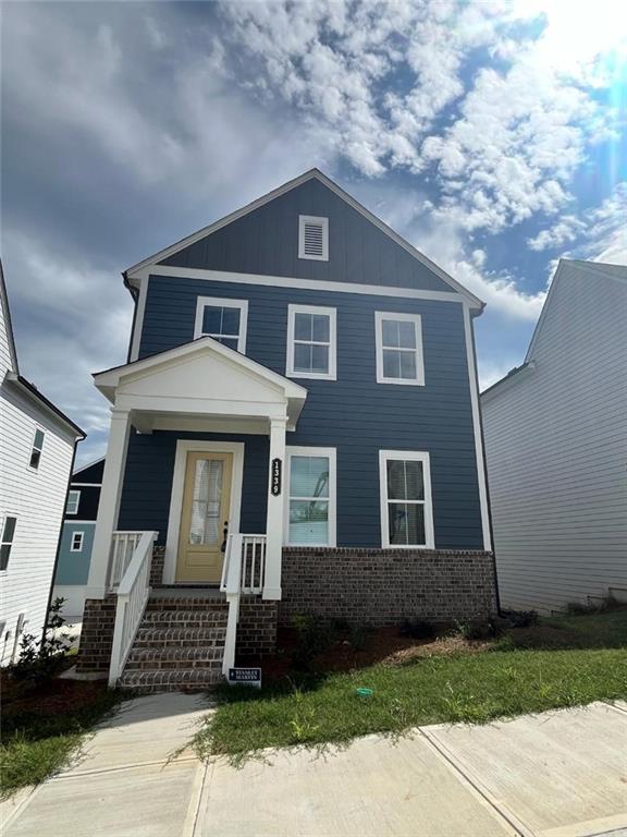 a front view of a house with a yard