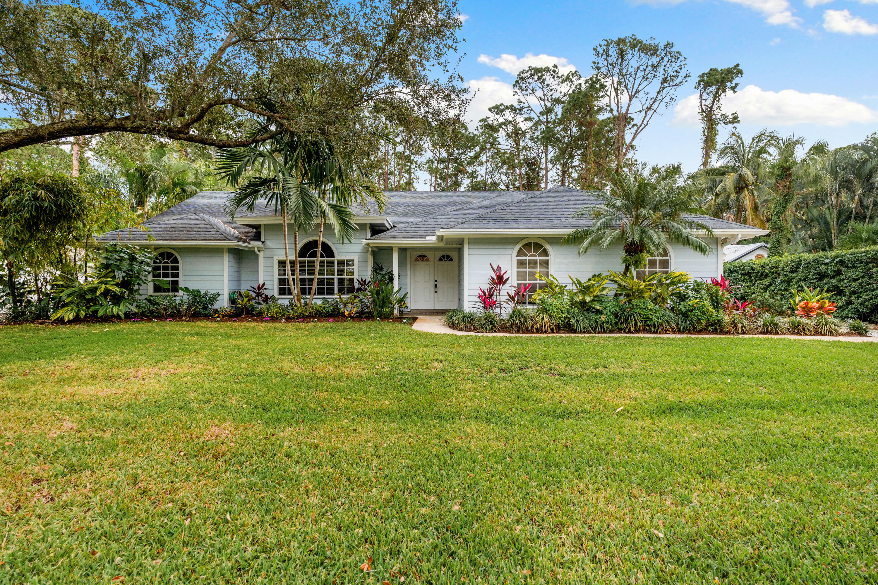 a front view of house with garden