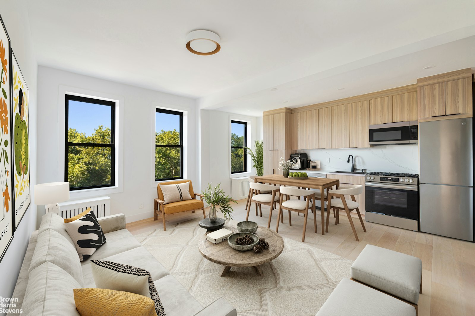 a living room with furniture kitchen view and a window