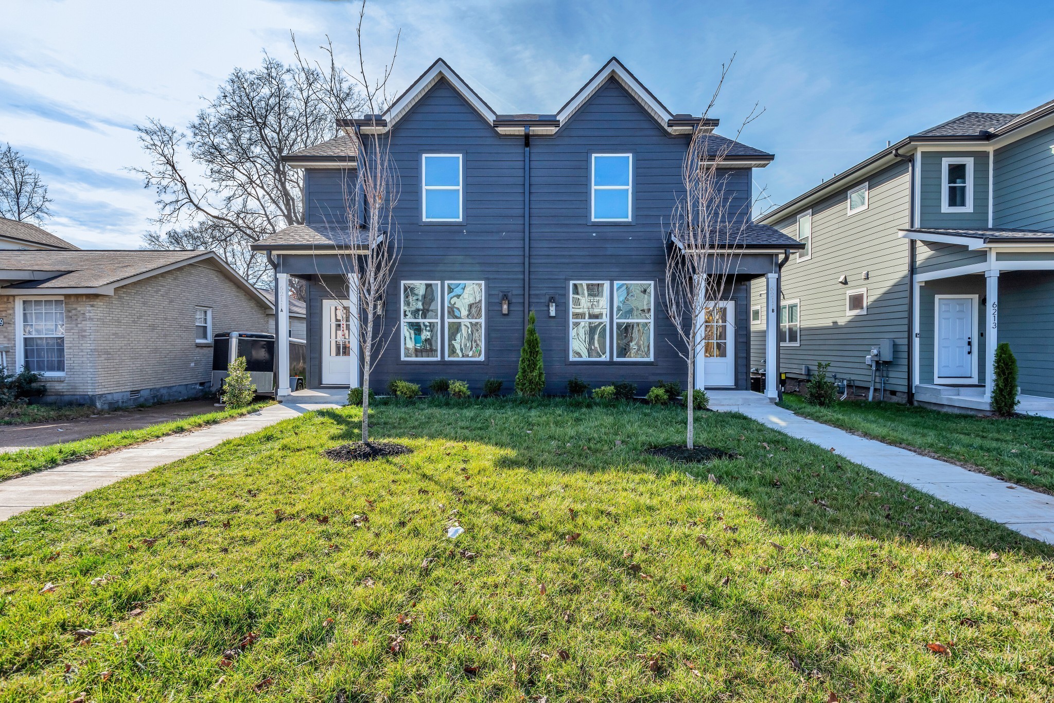 a front view of a house with a yard