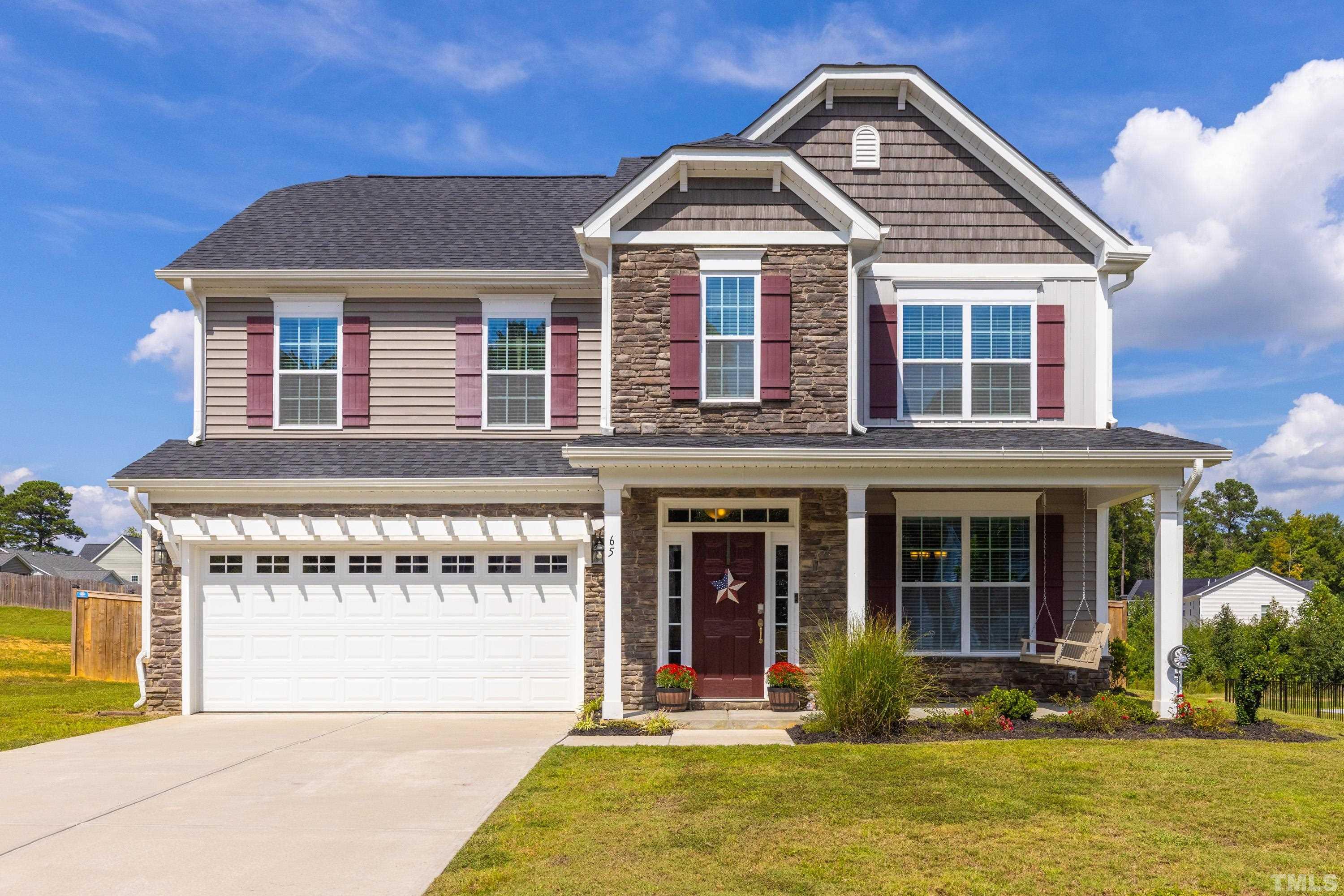 front view of a house with a yard