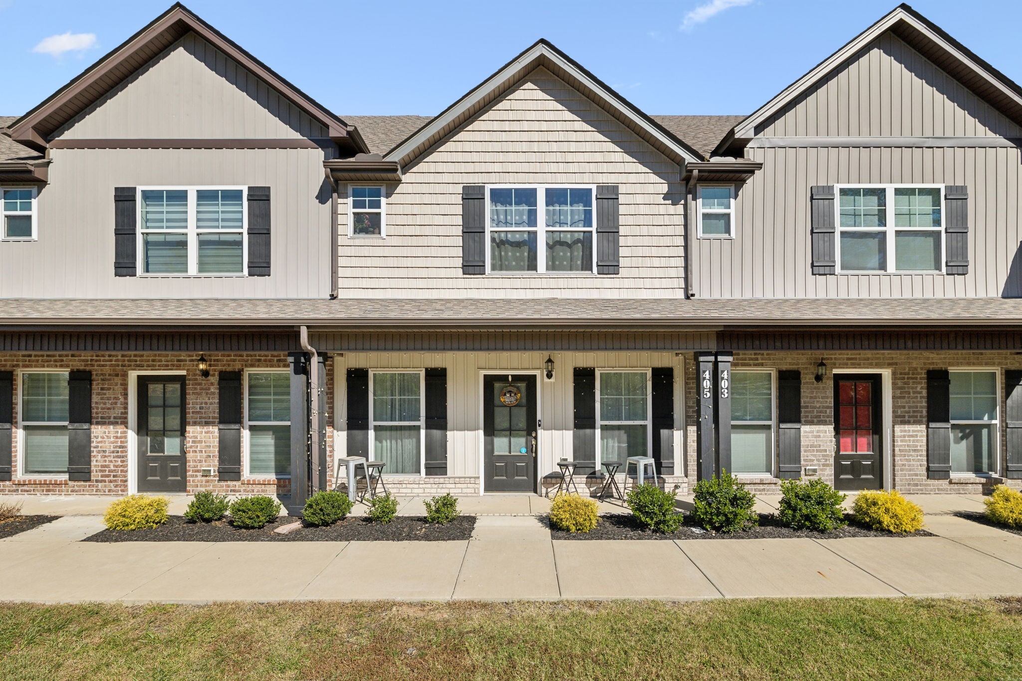 a front view of a house with a yard