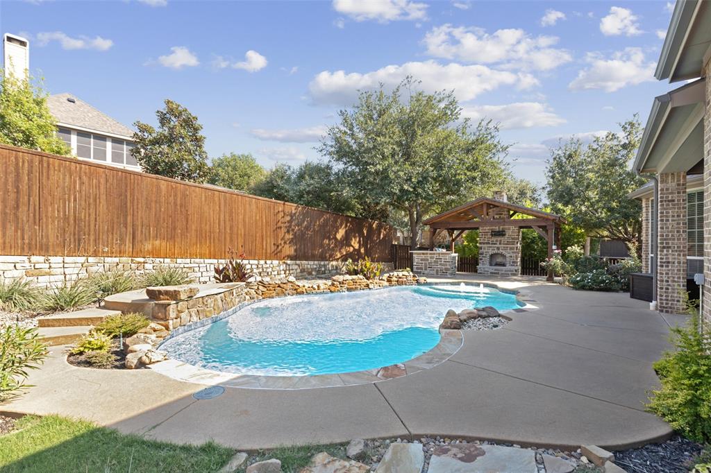 a view of a patio with swimming pool