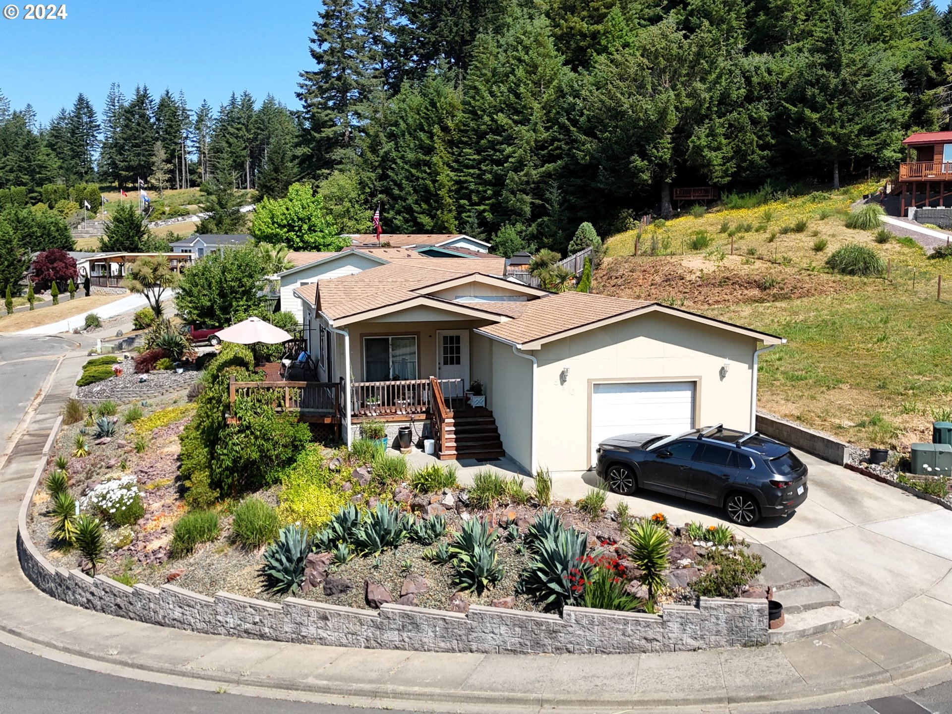 a front view of a house with garden