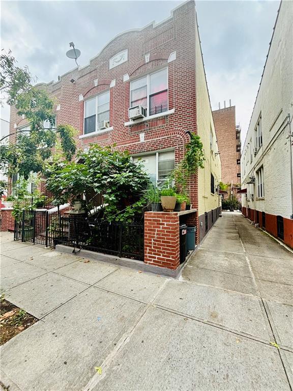 a view of a building with potted plants