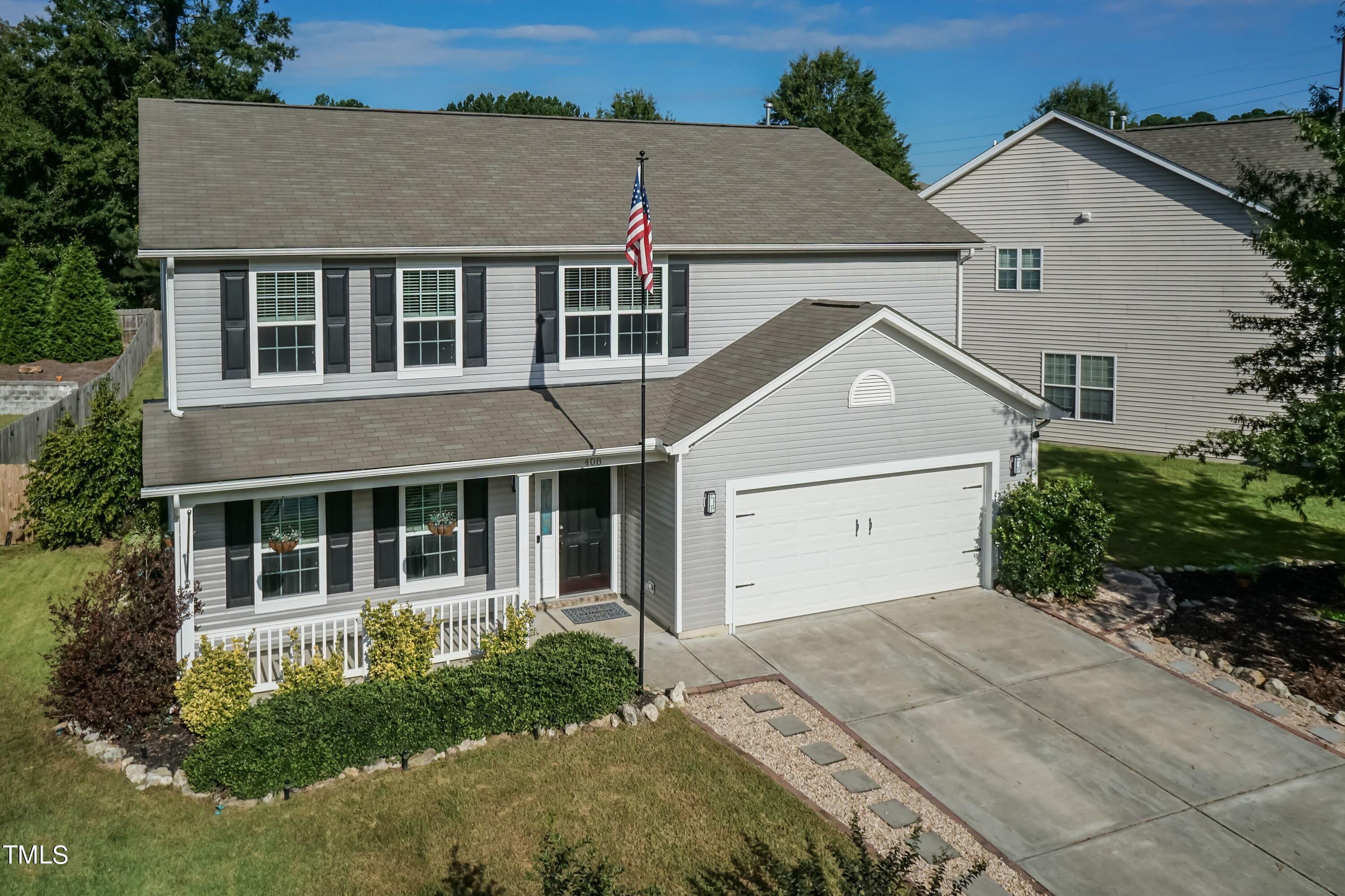 front view of a house with a yard