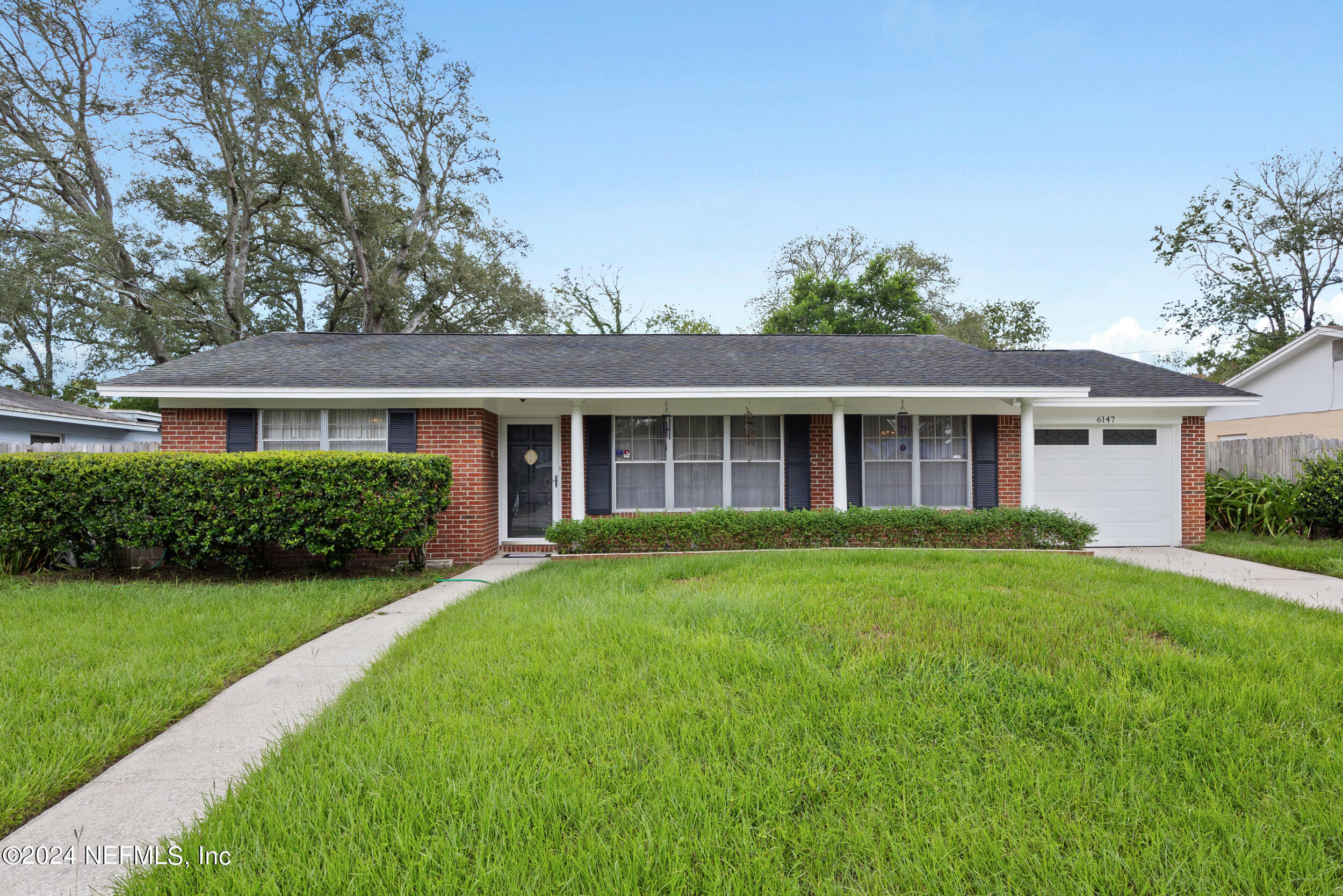 front view of a house and a yard