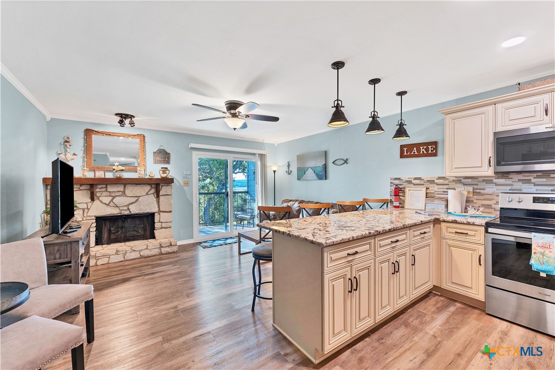 a kitchen with a stove oven and sink