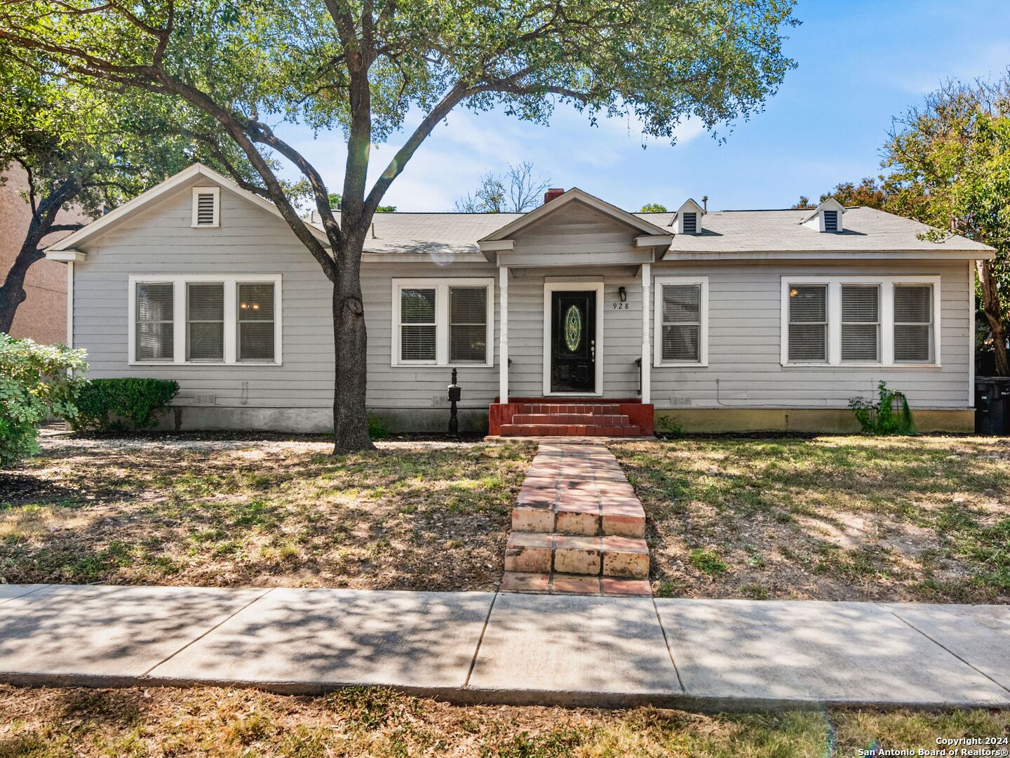 a front view of a house with yard