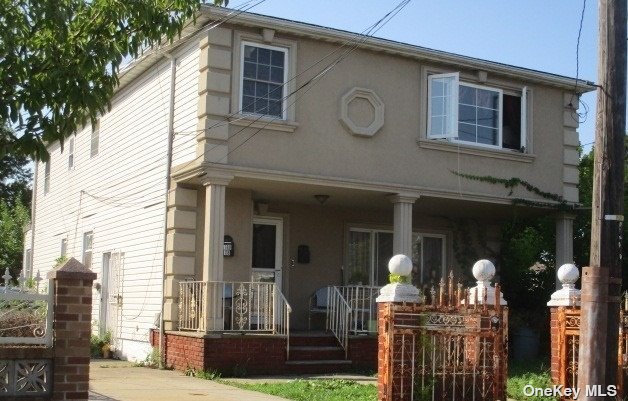 a front view of a house with glass windows