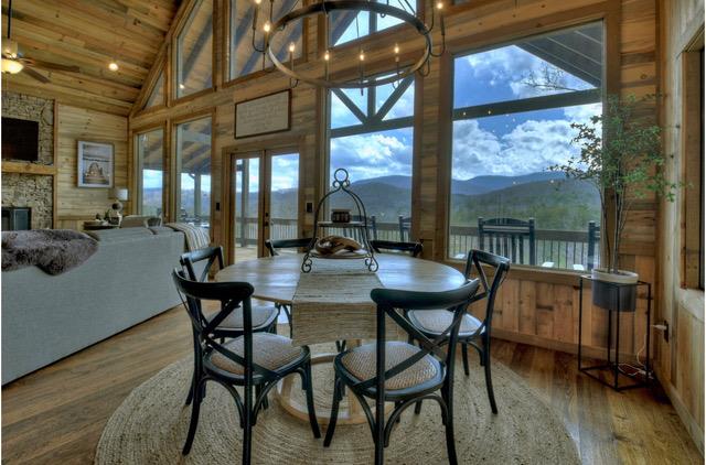 a dining room with furniture and wooden floor