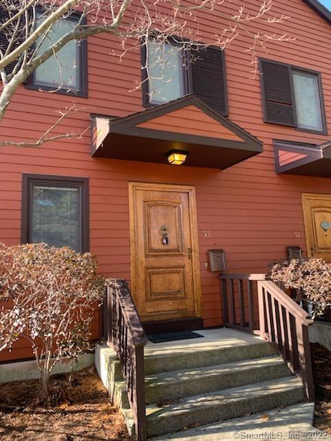 a front view of a house with parking