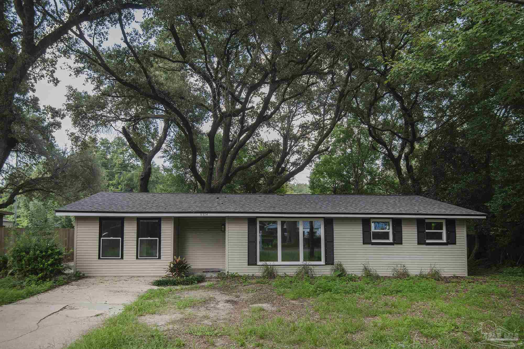 front view of a house with a yard