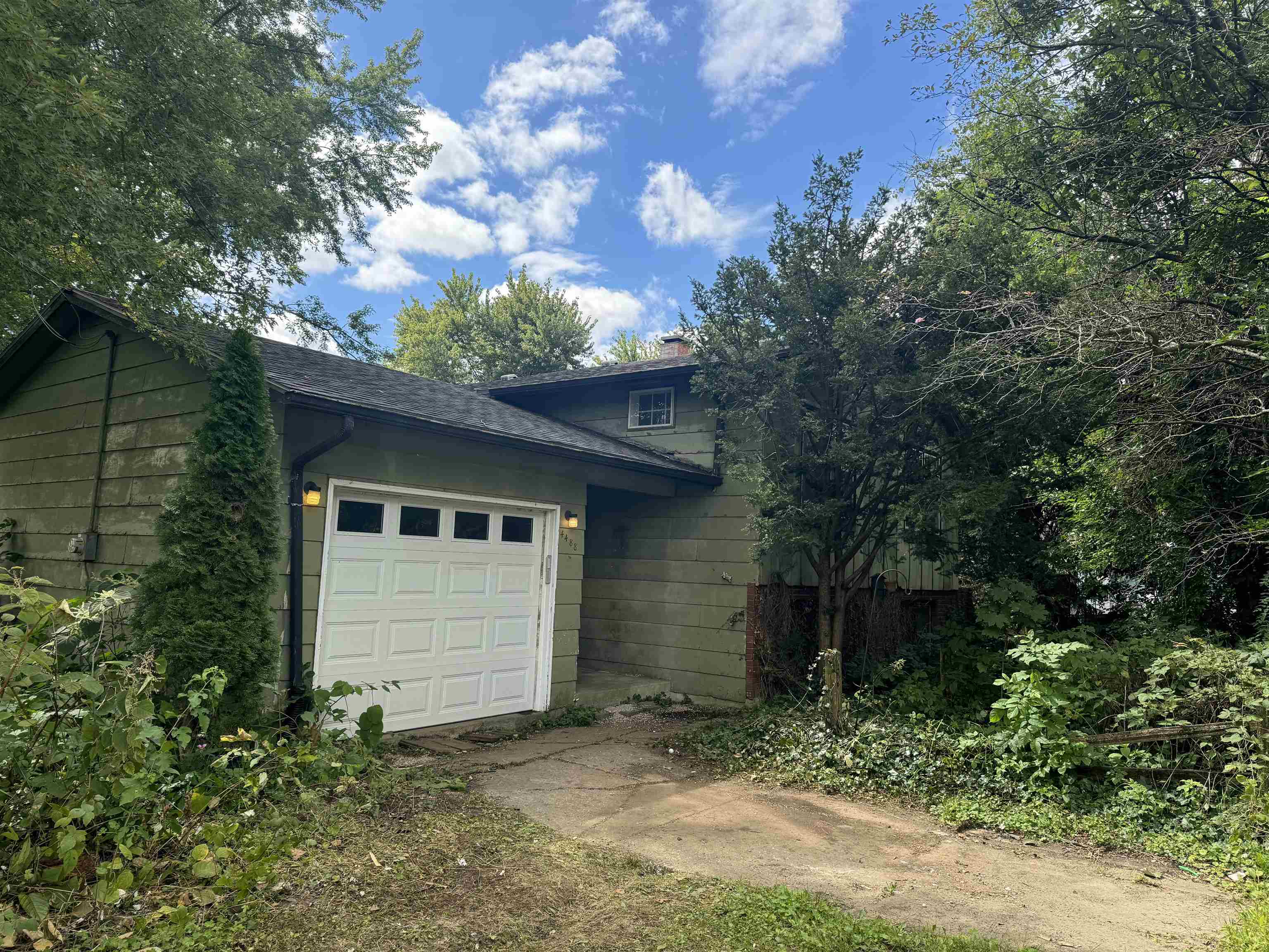 a view of house with trees in the background