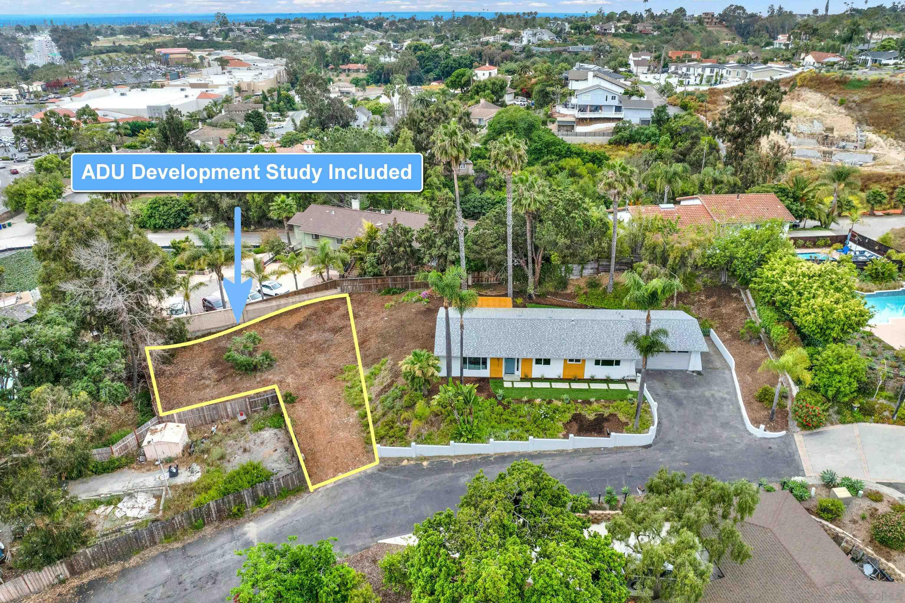 an aerial view of a house with a garden