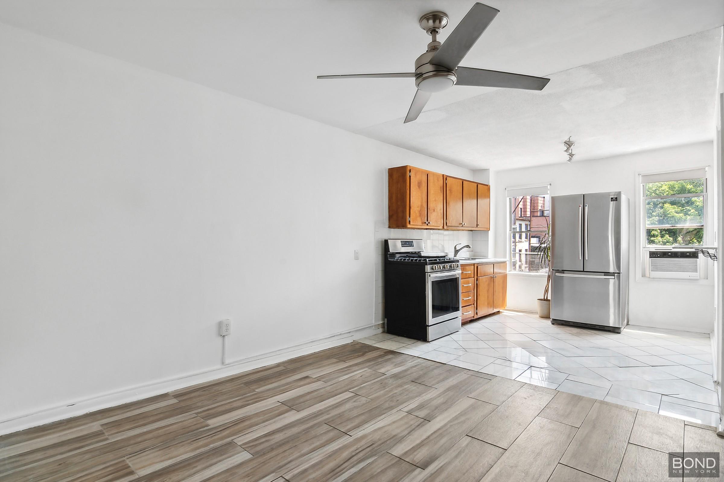 a kitchen with stainless steel appliances a refrigerator and a stove