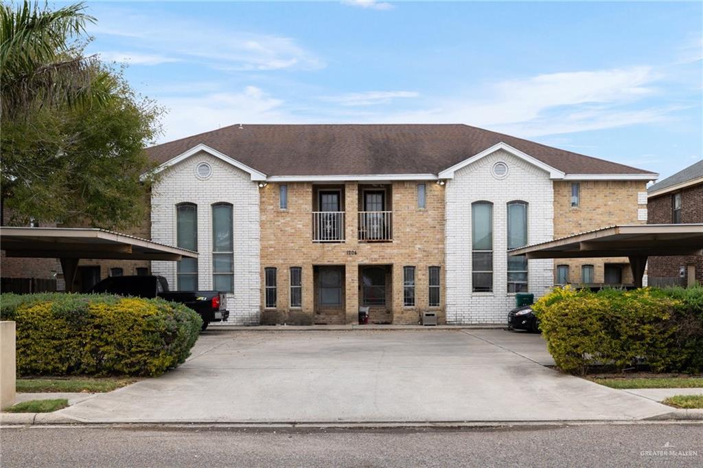 a front view of a house with a garage