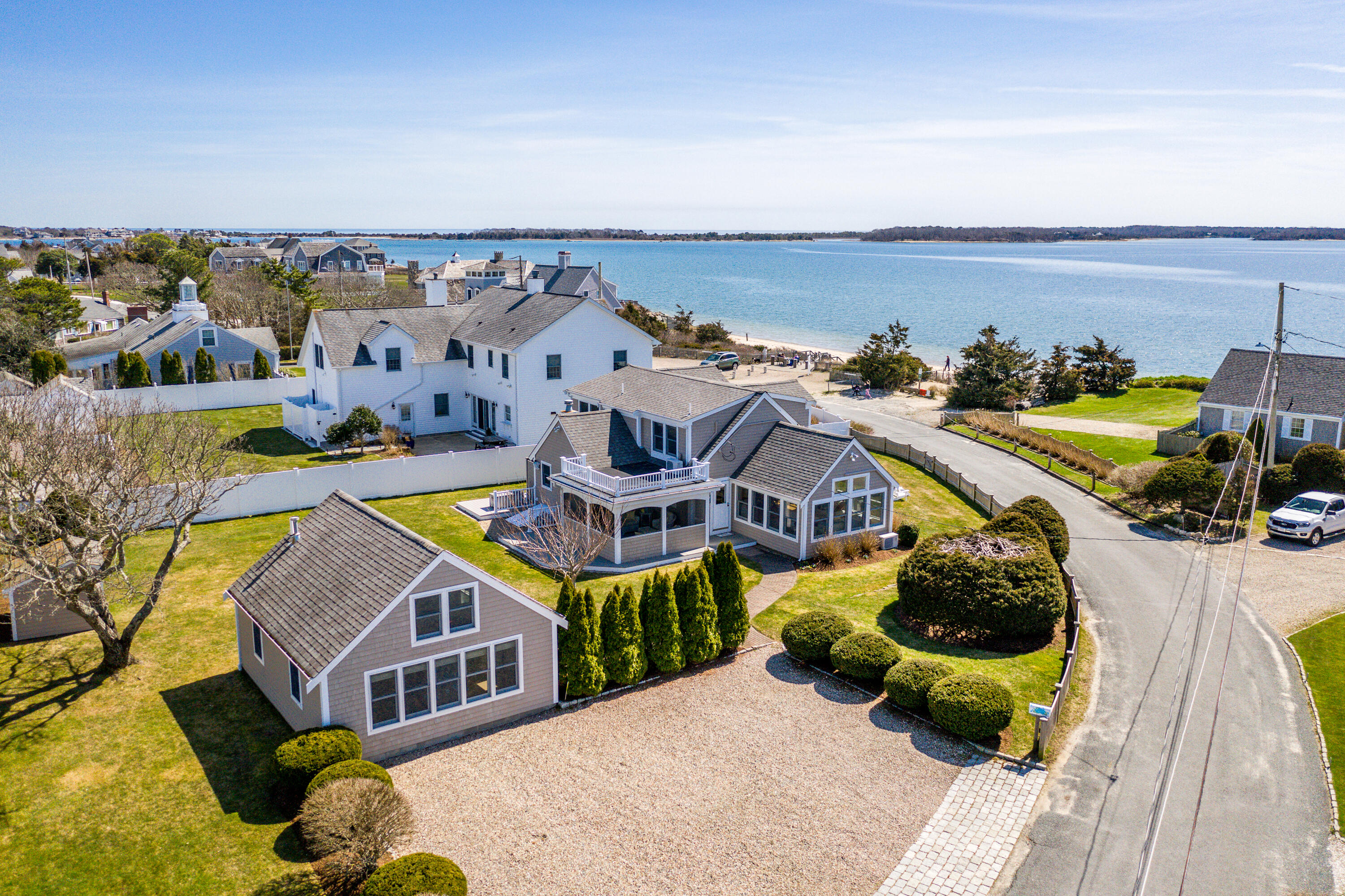 an aerial view of a house with swimming pool and ocean view