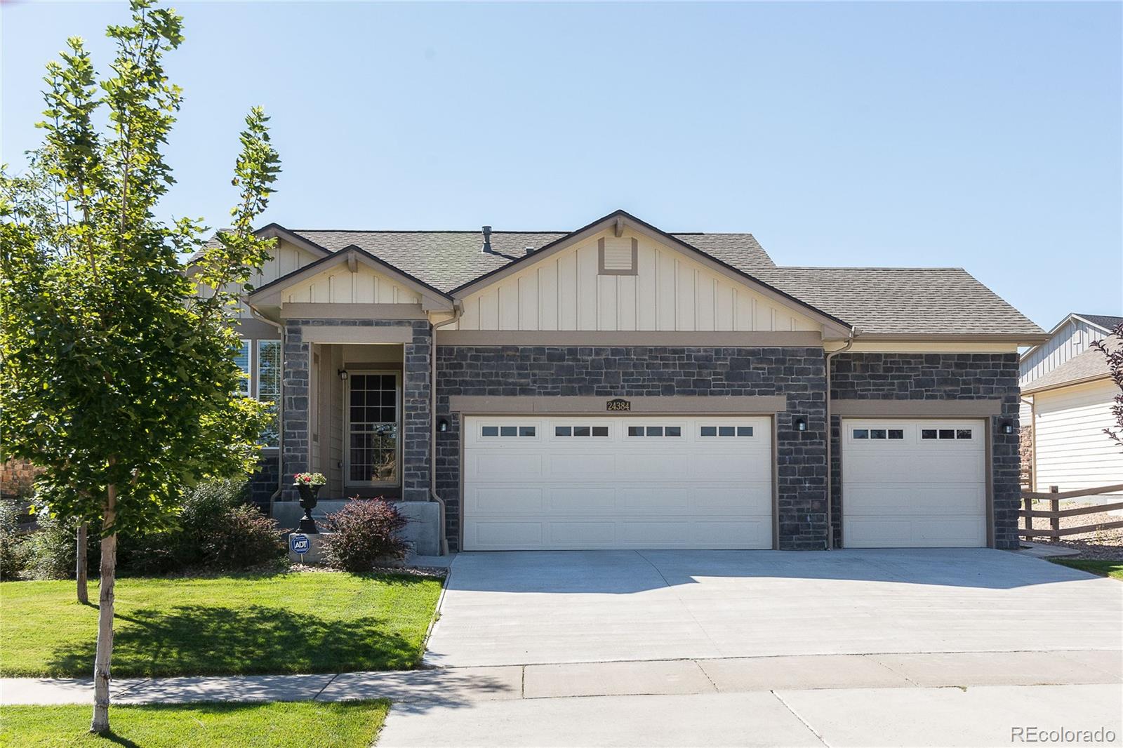 a front view of a house with a yard