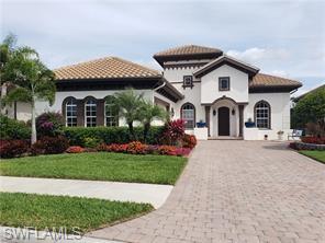 Mediterranean / spanish house featuring a front lawn